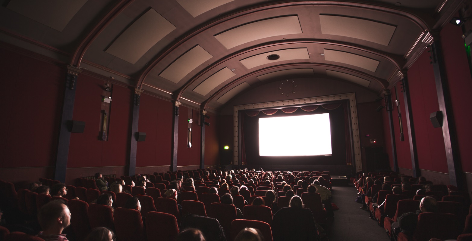 Movie theaters return masked up.