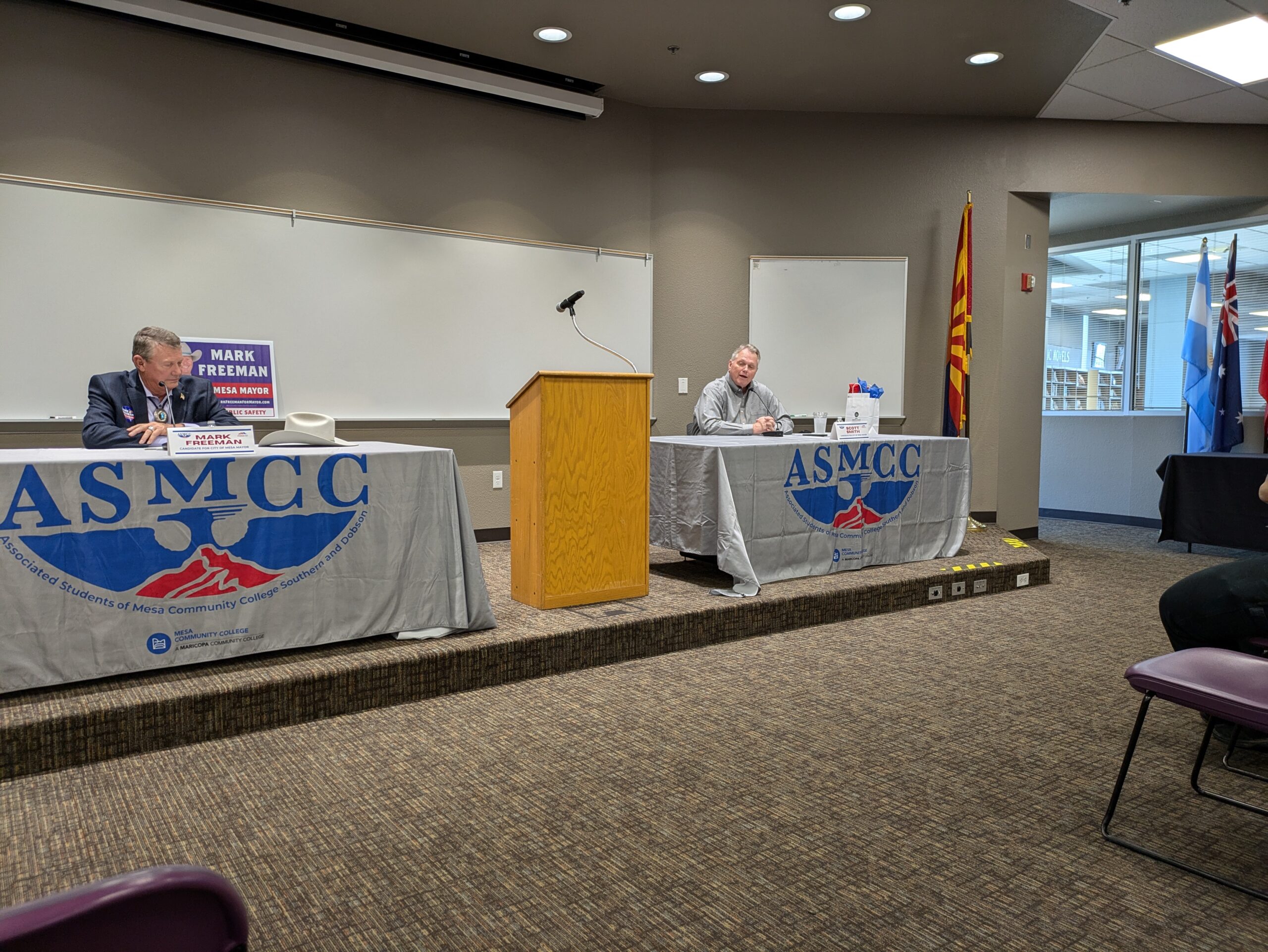 Mark Freeman (left) listening to Scott Smith (right) at the Your Mesa, Your Voice Mayoral Candidate Forum at Mesa Community College’s Southern and Dobson campus on Oct. 2, 2024. (Riley Weathersbee/The Mesa Legend)