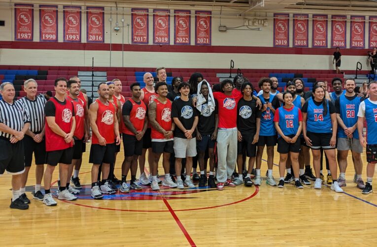 Alumni go head-to-head against first responders during basketball fundraiser game