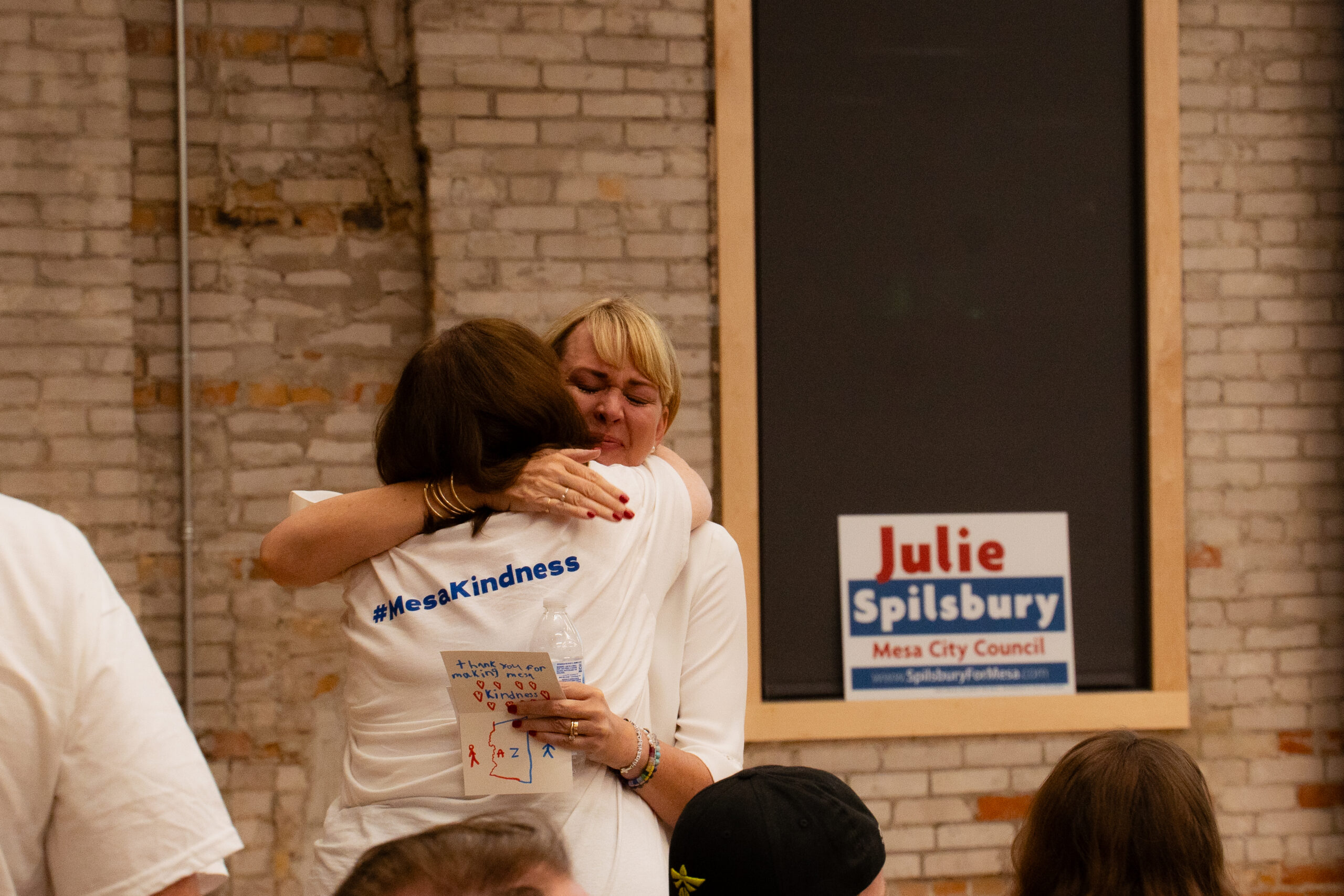 Mesa Councilmember Julie Spilsbury embraces a supporter at an Election Day watch party on Nov. 4, 2025. (Photo by Gwendolyn Owen/The Legend)