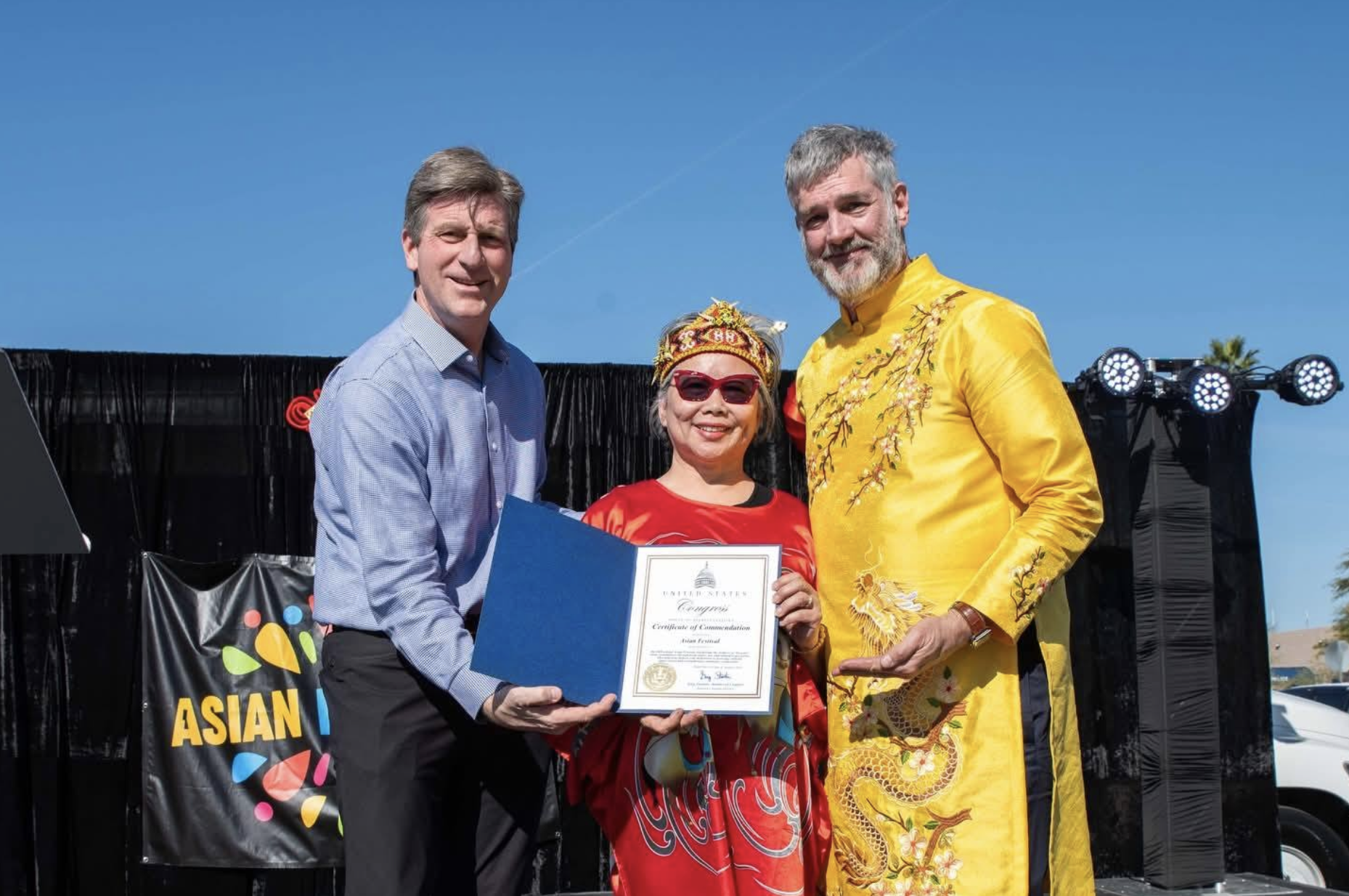 Representative Greg Stanton presents Honorary Consul of Malaysia Winnie Kho Kaplan and Founder of the Asian Festival Steve Kaplan with a Congressional Certificate of Commendation honoring the Asian Festival’s dedication strengthening community connections on Jan. 31, 2026. (Photo courtesy of Asian Festival)