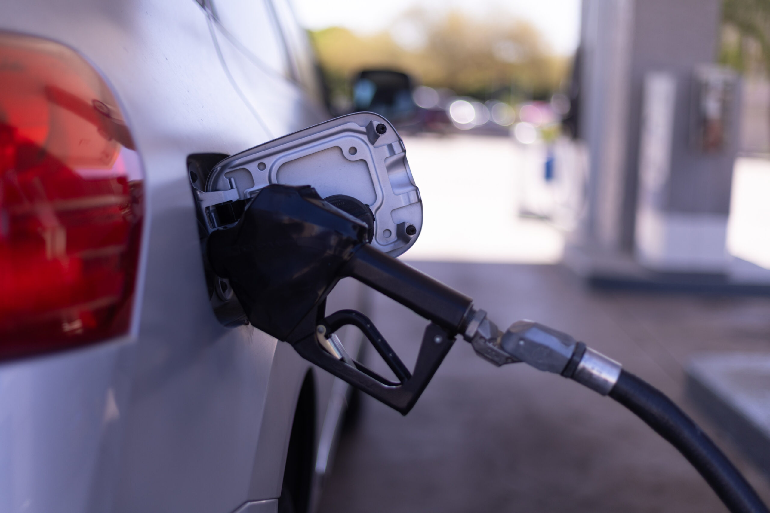 Gas pump fueling up a car